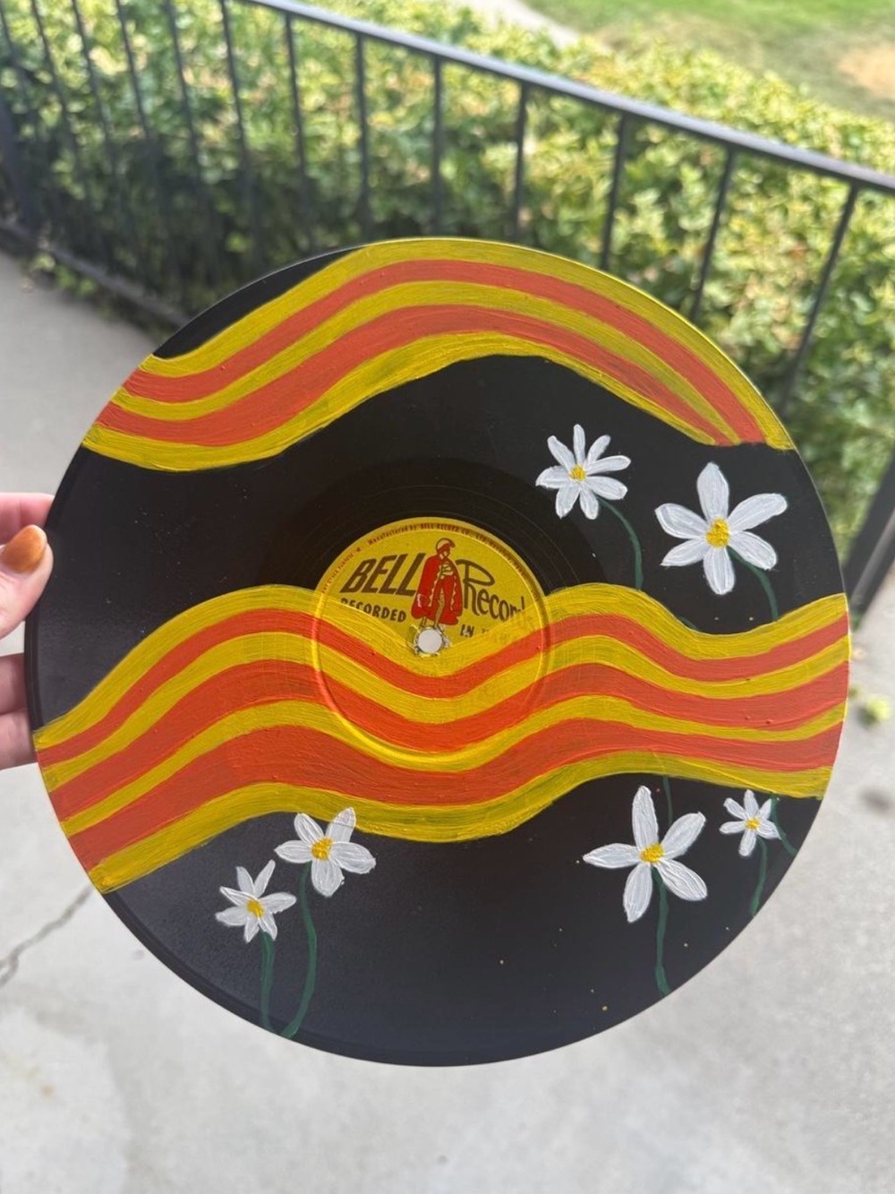 Black Vinyl Wall Art with Yellow & Orange Waves and White Daisies